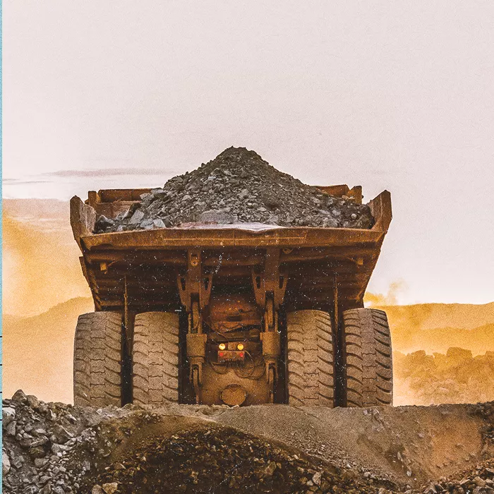 Haul truck moving stones and gravel
