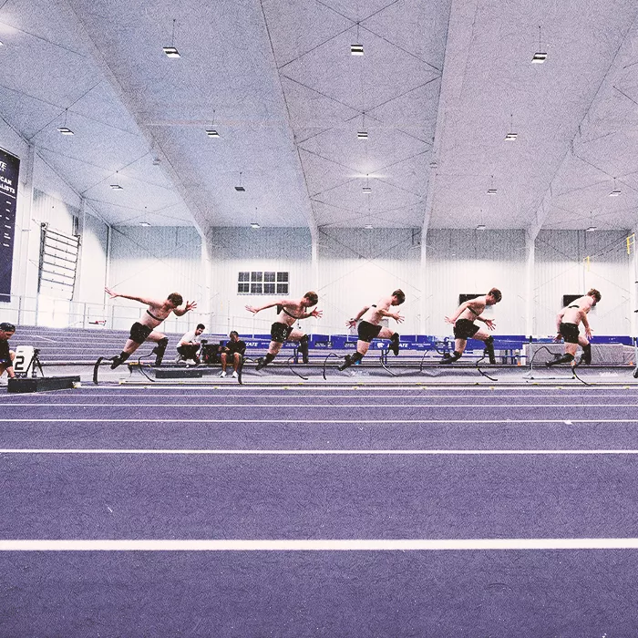 Runner Hunter Woodhall on an indoor track