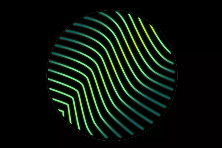 Circle with waved lines of various greens on black surface.