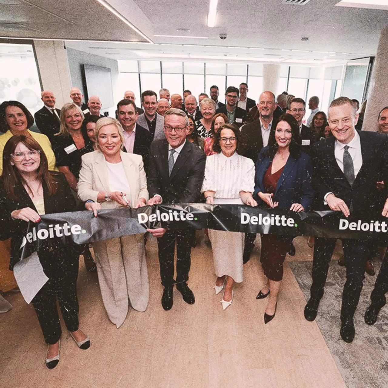 Happy people holding a banner