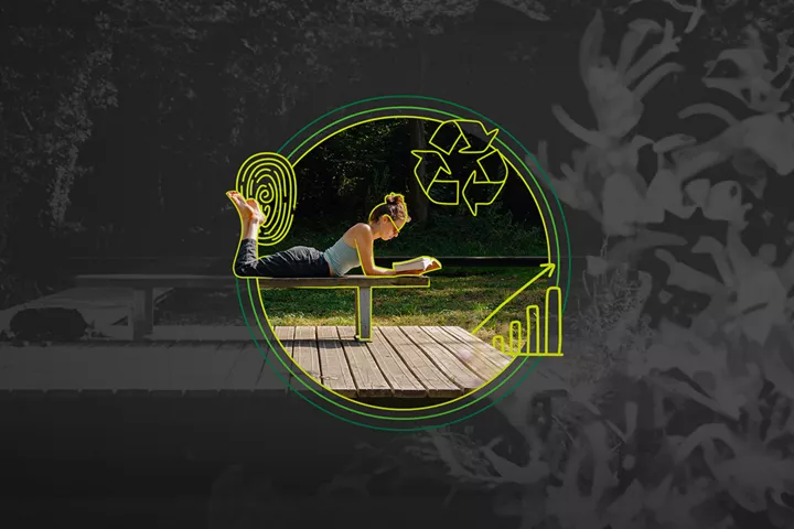 A person is lying on their stomach on the wooden deck