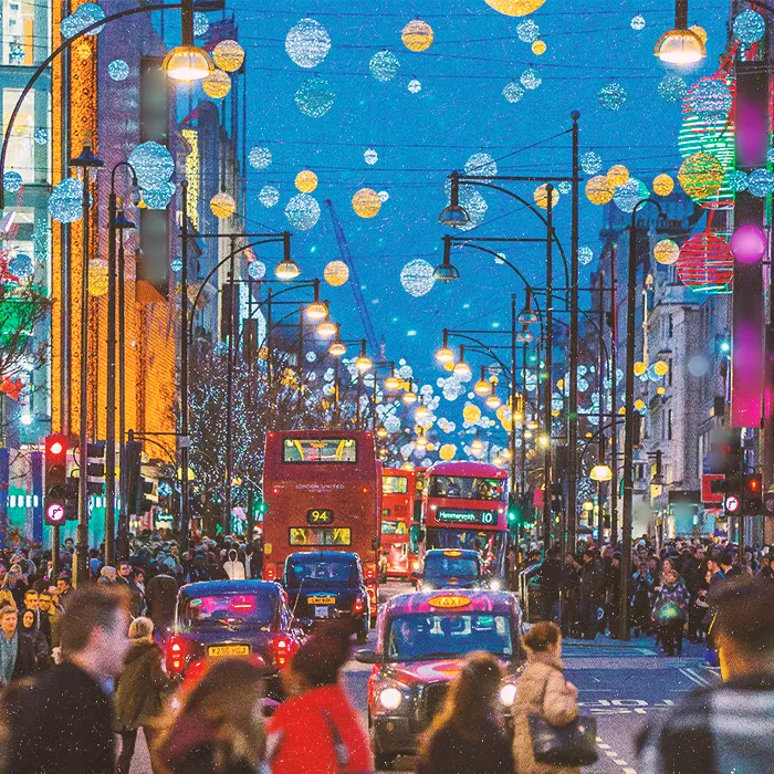 Busy evening city street with street light decorations