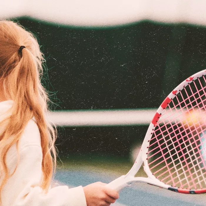 Girl holding tennis racquet